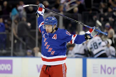 New York Rangers forward Artemi Panarin stretches during 2026 game.